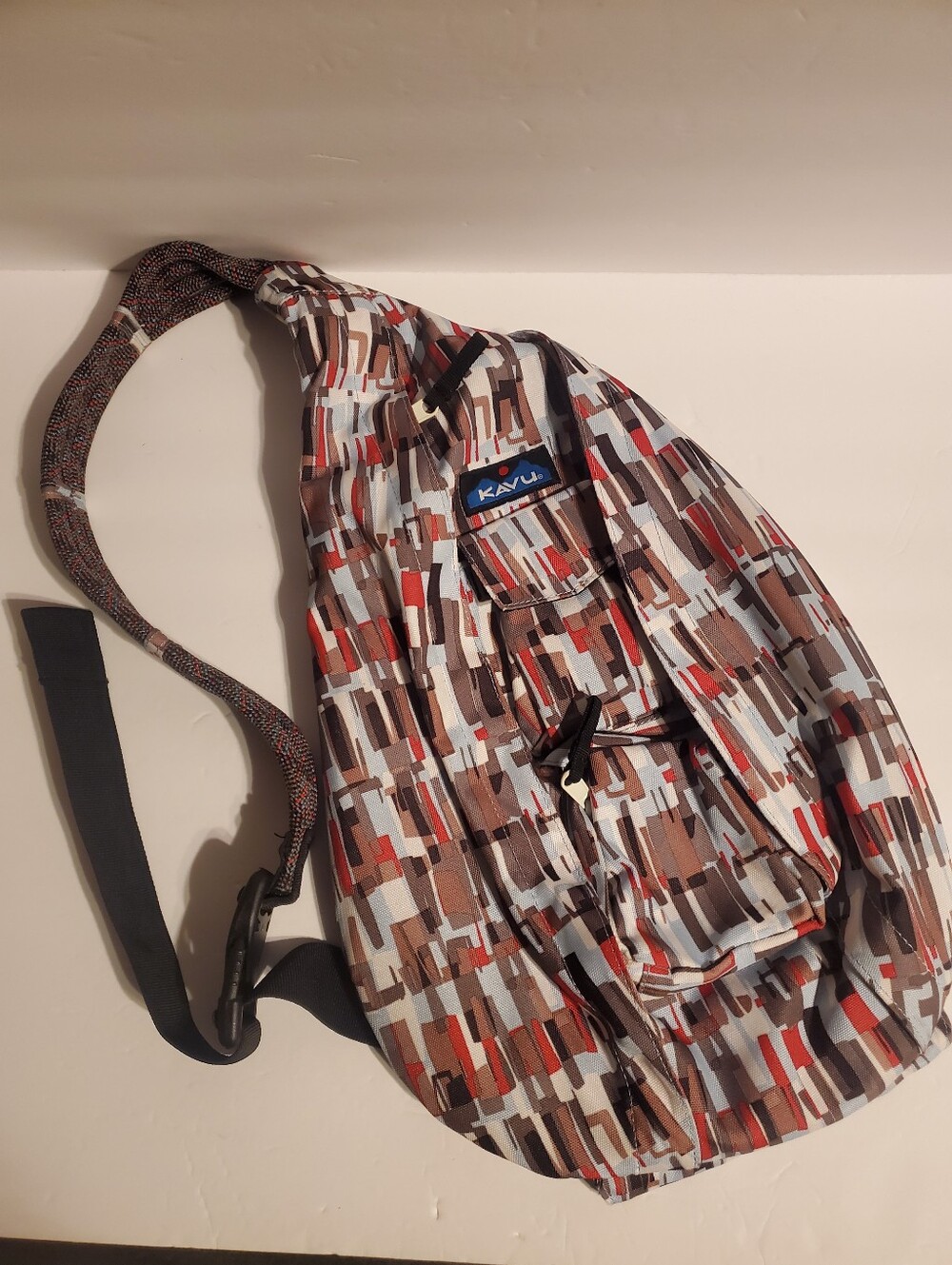 KAVU Rope Sling Bag in the Multi-Colored Geometric Pattern Known as "Mesa"